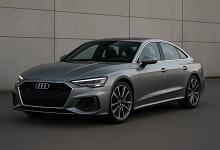 2025 Audi A5 Sedan in metallic silver on scenic road.