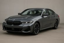 2025 BMW 3-Series parked on a modern city street.