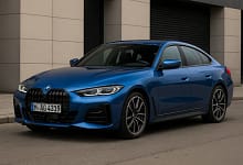 2025 BMW 4-Series Gran Coupe in blue, side front view.