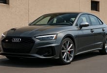 2025 Audi S5 parked on a scenic road with a sporty design.