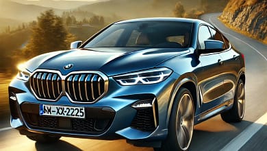 2025 BMW X6 in metallic blue on a mountain road at sunset, showcasing its bold grille, LED headlights, and sporty coupe-like design.