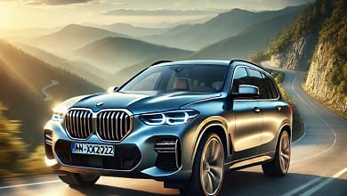 2025 BMW X5 on a mountain road at sunset, showcasing its sleek design.