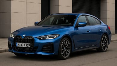 2025 BMW 4-Series Gran Coupe in blue, side front view.