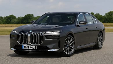 2025 BMW 7 Series luxury sedan in a modern city background.