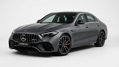 2025 Mercedes-AMG C63 S E Performance front view, grey color, parked outdoors.